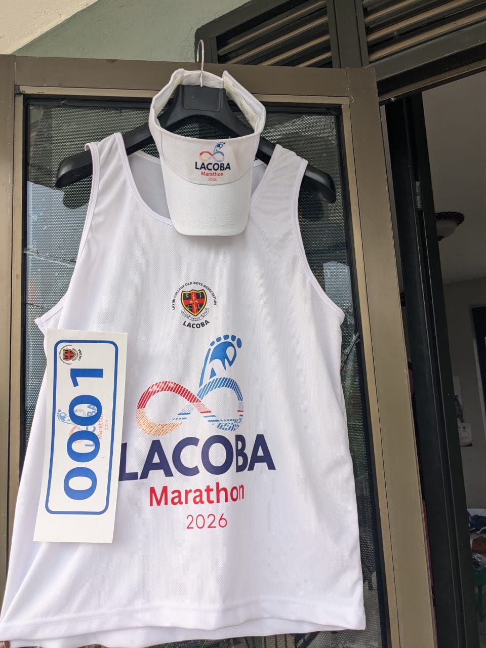 A marathon running vest, cap and race bib set, ready for event day