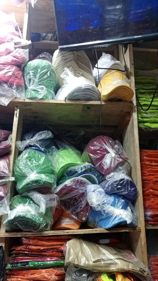 Branded caps and stock ready for sale, representing the small businesses and retailers we serve